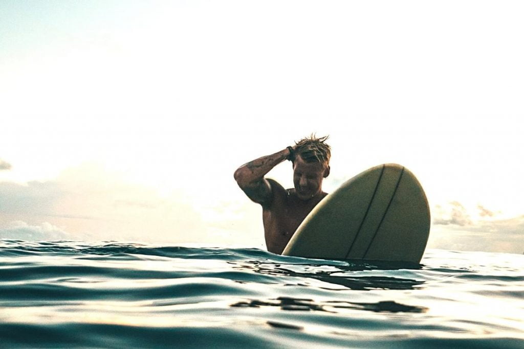 Illustration of a man surfing on an airlie beach